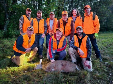 deer hunt group with deer